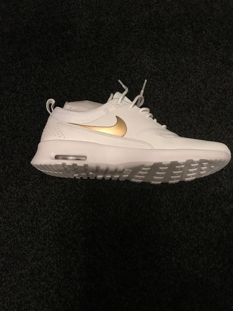 womens nike trainers with gold tick